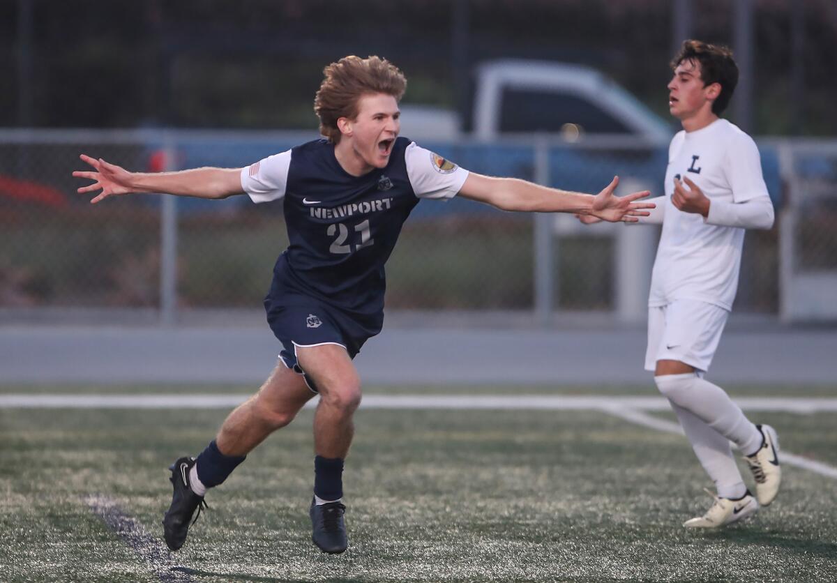 Newport Harbor's Beck Brosnan (21) reacts to scoring the game's second goal against Loyola on Friday.