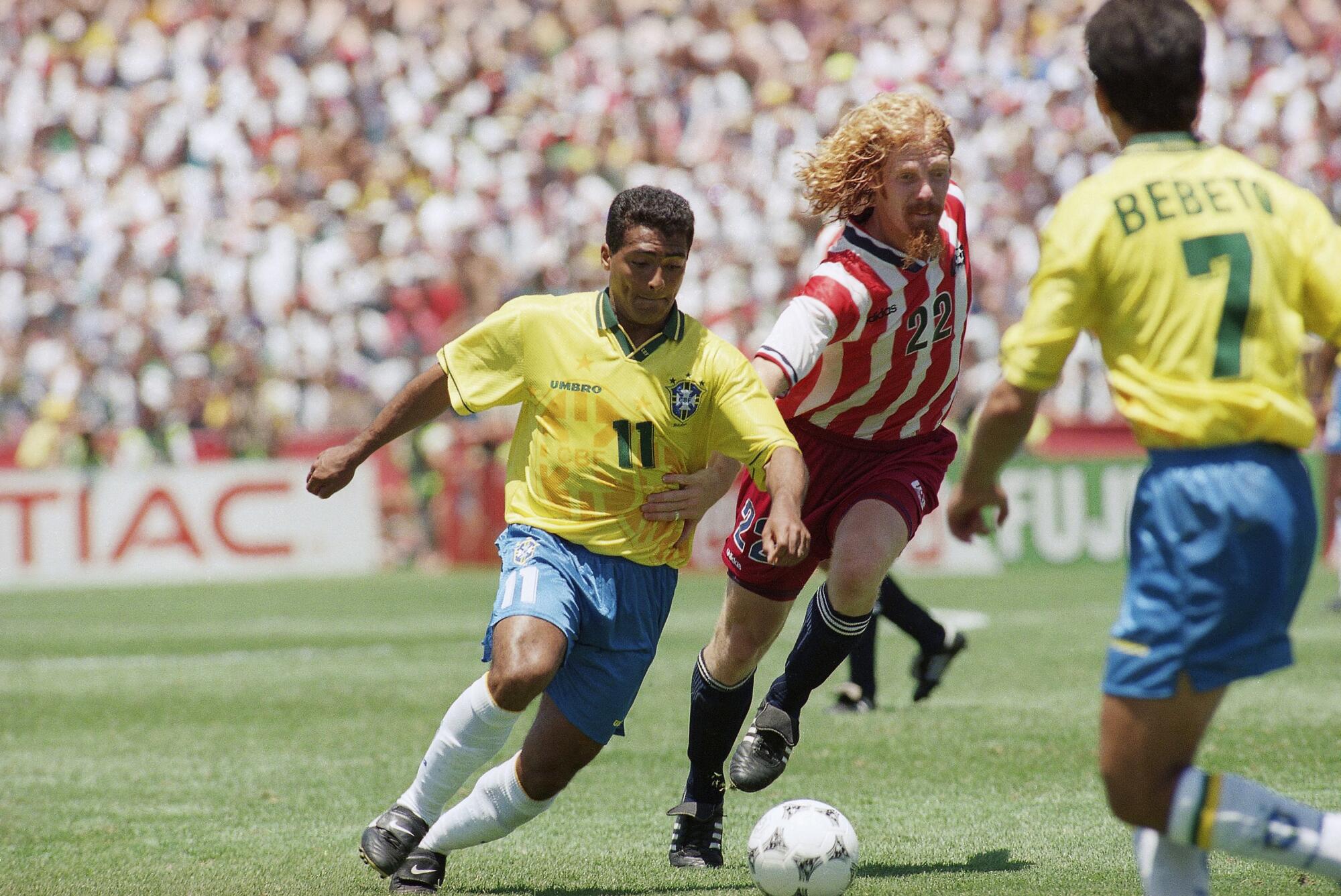 Brazil's Romario, left, battles U.S. defender Alexi Lalas during a World Cup match July 4, 1994, in Palo Alto.