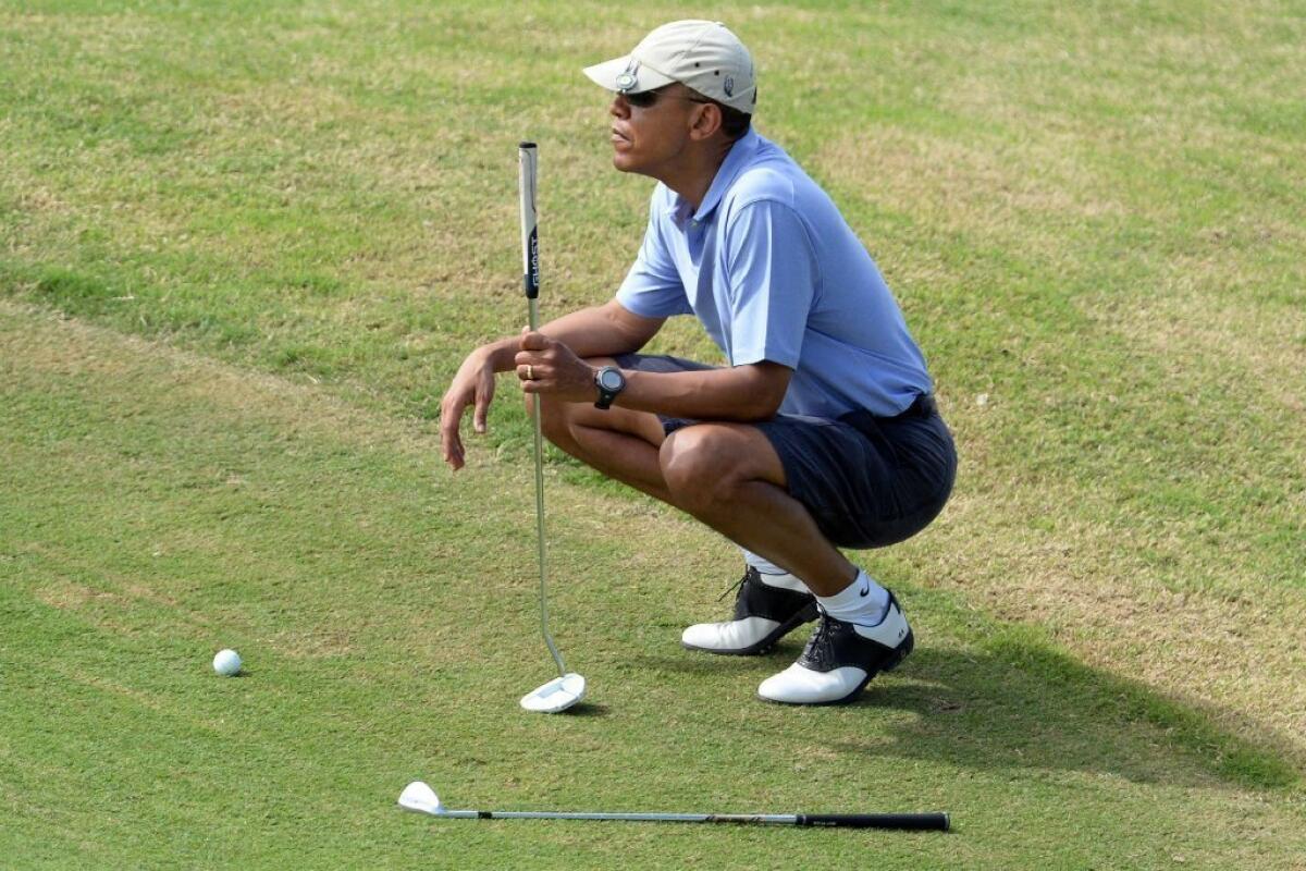 President Obama plays golf at Mid-Pacific Country Club in Kailua, Hawaii, on Monday.