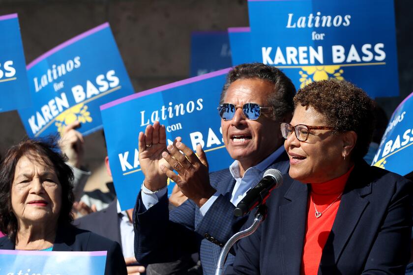 LOS ANGELES, CALIF. - APR. 12, 2022. Pioneering farm labor leader, Dolores Huerta, left, and former Los Angeles Mayor Antonio Villaraigosa show their support for L.A. Mayoral candidate Karen Bass, right, during a campaign event in Mariachi Plaza on Tuesday, April 12, 2022. Recent polls show that Bass and real estate developer Rick Caruso are virtually tied in the race to replace outgoing Eric Garcetti. (Luis Sinco / Los Angeles Times)