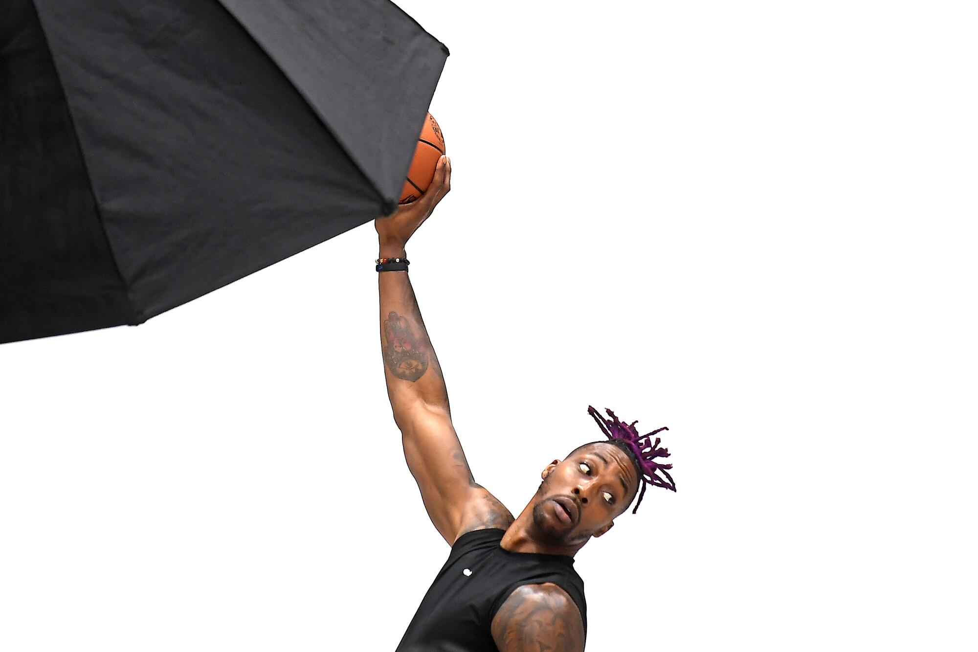 Dwight Howard poses for pictures during the Lakers' media day.