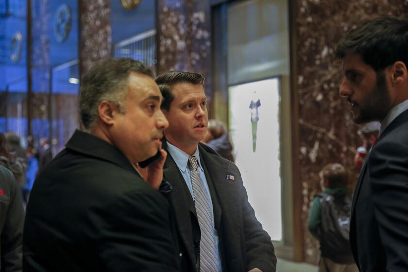 FILE - In this Dec. 12, 2016 file photo, Los Angeles venture capitalist Imaad Zuberi, far left, arrives at Trump Tower in New York. Federal prosecutors in New York have informed Zuberi, a major donor to President Donald Trump’s inaugural committee, that they intend to charge him with obstruction of justice and failing to register as a foreign agent. Attorneys for Zuberi filed papers late Thursday, Nov. 21, 2019, seeking a continuance of Zuberi's court proceedings in Los Angeles. (AP Photo/Kathy Willens, File)