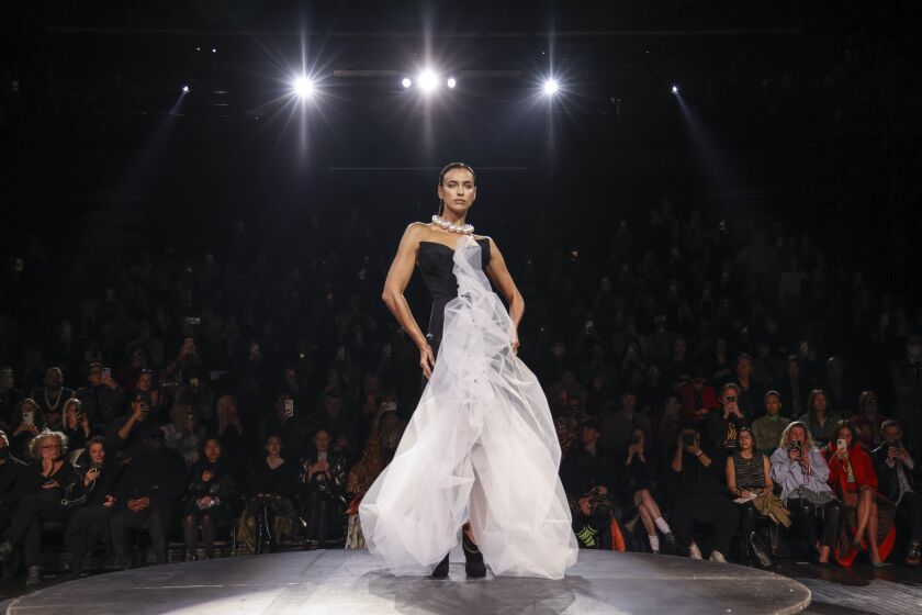 Irina Shayk wears a creation for the Vivienne Westwood ready-to-wear Spring/Summer 2023 fashion collection presented Saturday, Oct. 1, 2022 in Paris. (Photo by Vianney Le Caer/Invision/AP)