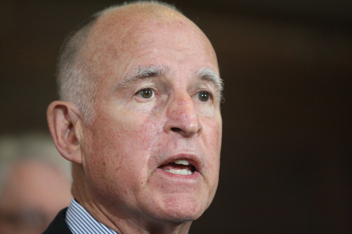 Gov. Jerry Brown, shown at an event at Los Angeles City Hall in February, and other state lawmakers spoke Monday at a conference hosted by Tom Steyer, a major Democratic donor who has wielded his financial clout to urge action on climate change.