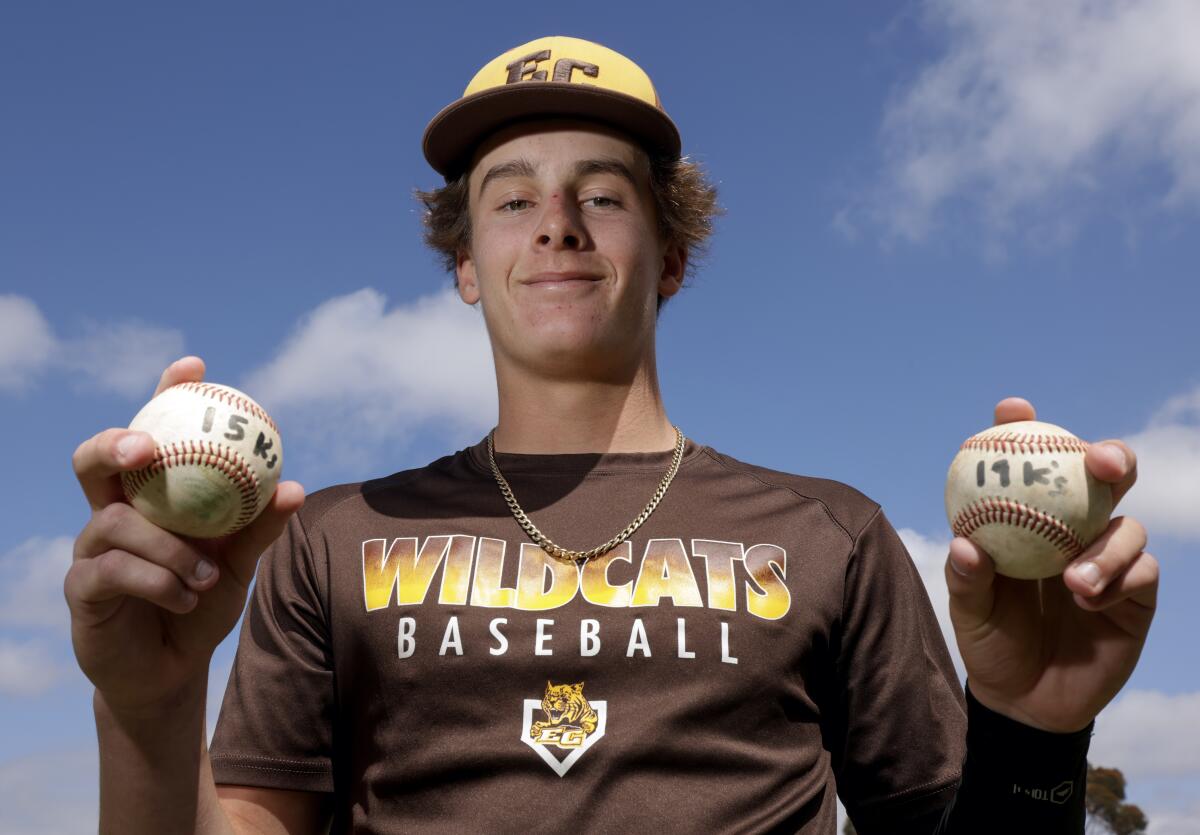 El Camino pitcher Zane Nordquist holds his two no-hitter baseballs during a practice last month.