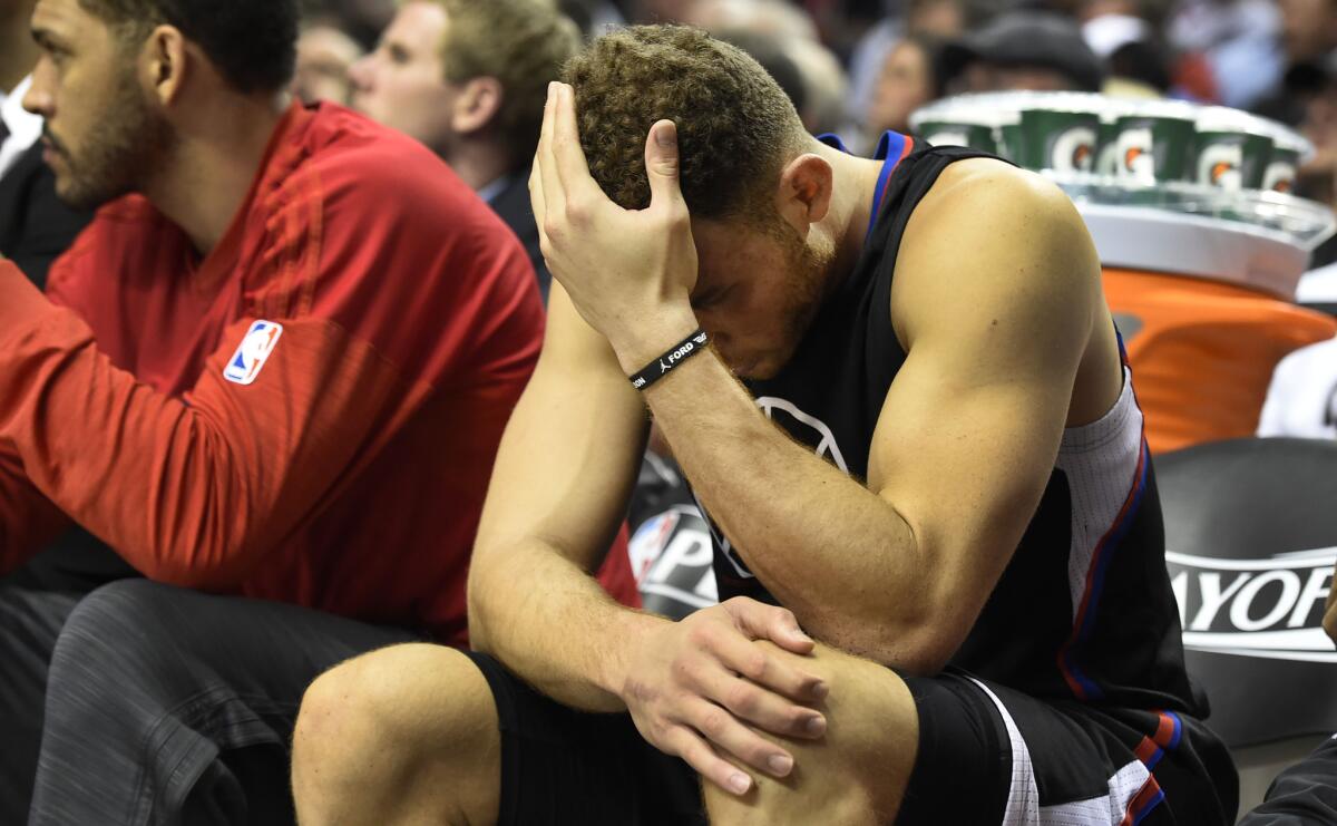 Blake Griffin sits on the Clippers bench as time winds down in the fourth quarter of Monday night's loss to Portland.