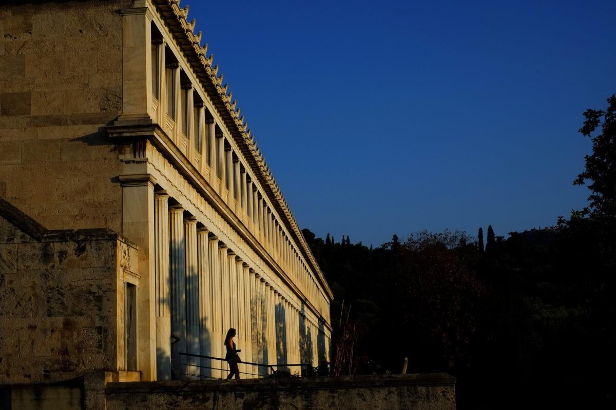 A woman visits the Museum of the Ancient Agora, Stoa of Attalos, in central Athens on Saturday. Greece's debt crisis is likely to adversely affect the country's arts institutions.