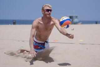 HERMOSA BEACH CA JUNE18, 2024 - Chase Budinger and beach volleyball partner Miles Evans.