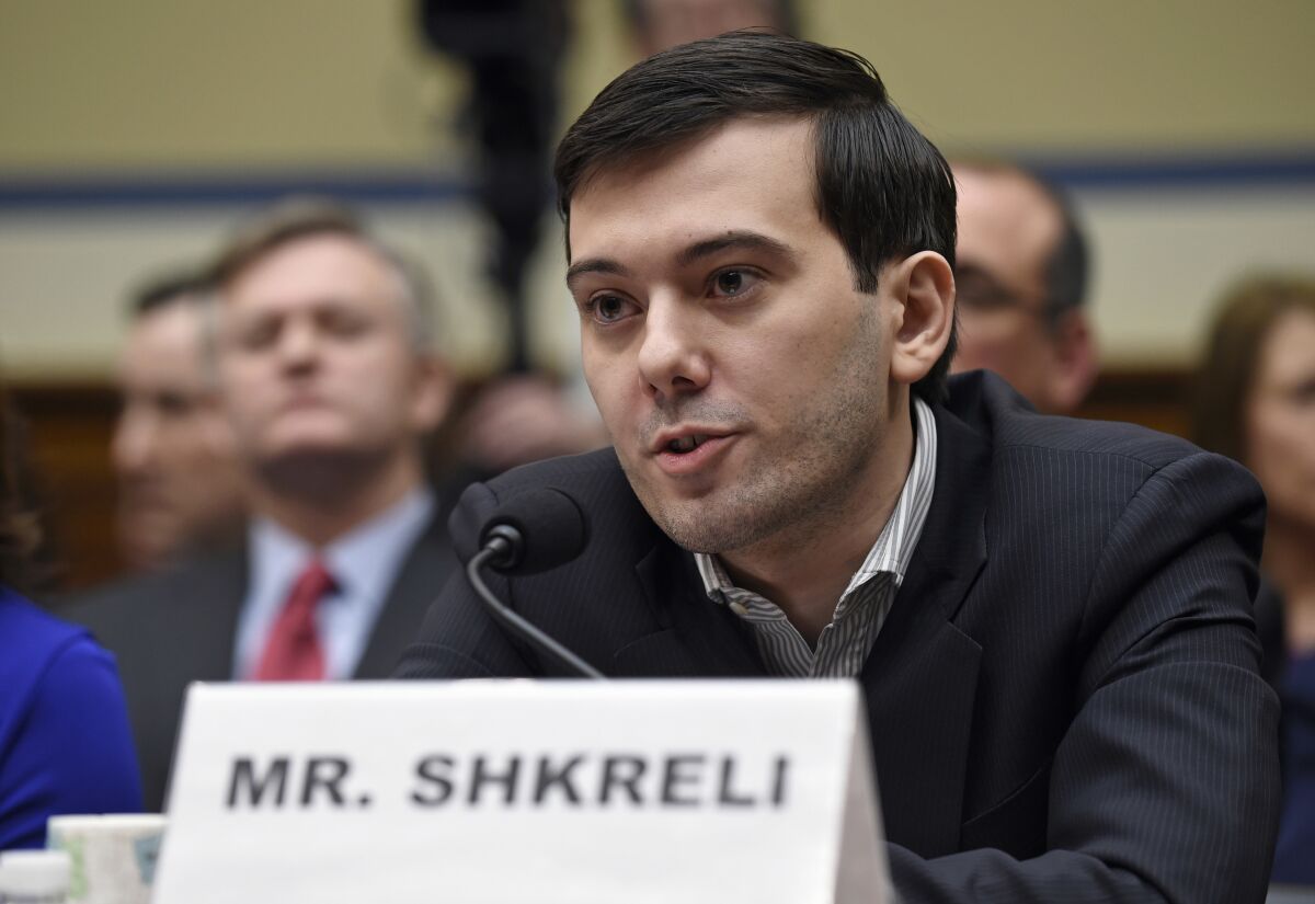 FILE- Pharmaceutical chief Martin Shkreli speaks on Capitol Hill in Washington, on Feb. 4, 2016, during the House Committee on Oversight and Reform Committee hearing on his former company's decision to raise the price of a lifesaving medicine. Vyera Pharmaceuticals, a company once owned by Shkreli, will pay up to $40 million to settle allegations that it jacked up the price of a life-saving medication by roughly 4 ,000% after obtaining exclusive rights to the drug. The Federal Trade Commission announced the settlement Tuesday, Dec. 7, 2021. (AP Photo/Susan Walsh, File)