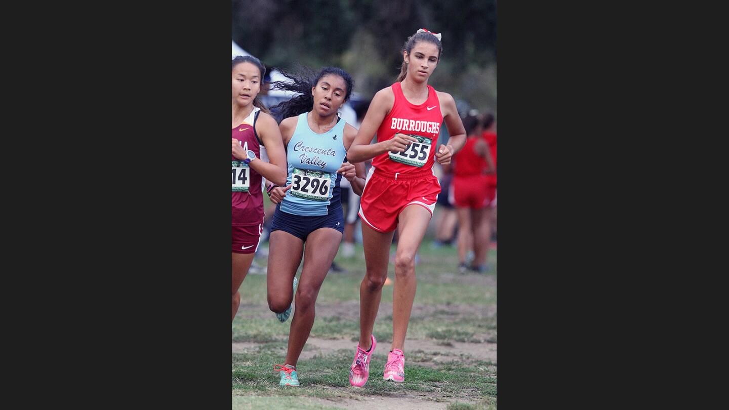 Crescenta Valley's Caitlyn Couch and Burroughs Emily Virtue midway on the route in a Pacific League cross girls' country meet at Arcadia County park in Arcadia on Tuesday, September 19, 2017. This is the first Pacific League meet of the season.