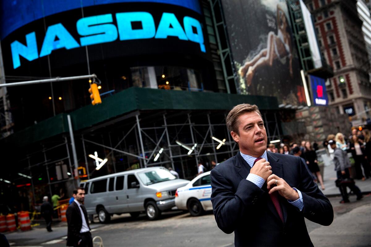 Scott Painter outside the Nasdaq Exchange in Times Square in 2014 after his company, TrueCar, went public. Painter's newest venture is Fair, a car-buying app.