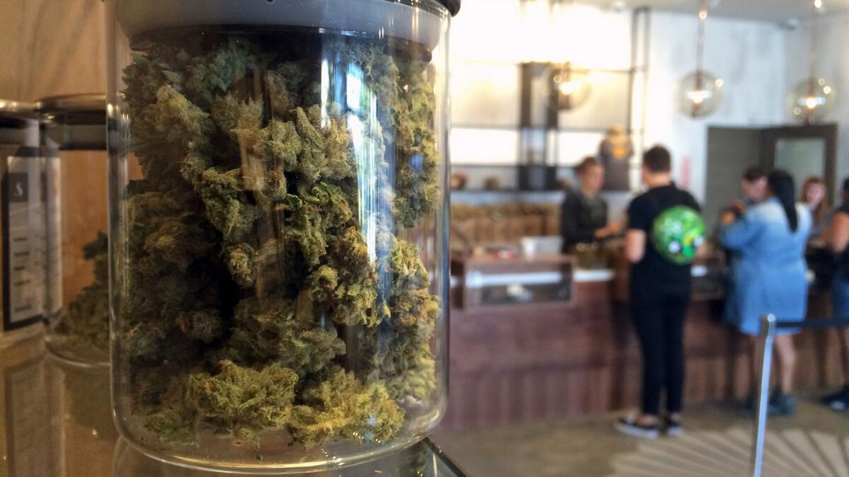 Customers buy products at a medical marijuana dispensary in San Francisco in April.