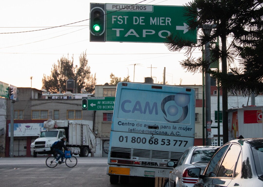 A CAM bus is parked in Mexico City.