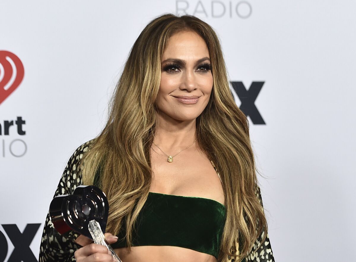 FILE - Jennifer Lopez appears in the press room with the Icon Award at the iHeartRadio Music Awards in Los Angeles on March 22, 2022. A Netflix documentary about Lopez titled “Halftime” will kick off the 21st Tribeca Film Festival (Photo by Jordan Strauss/Invision/AP, File)