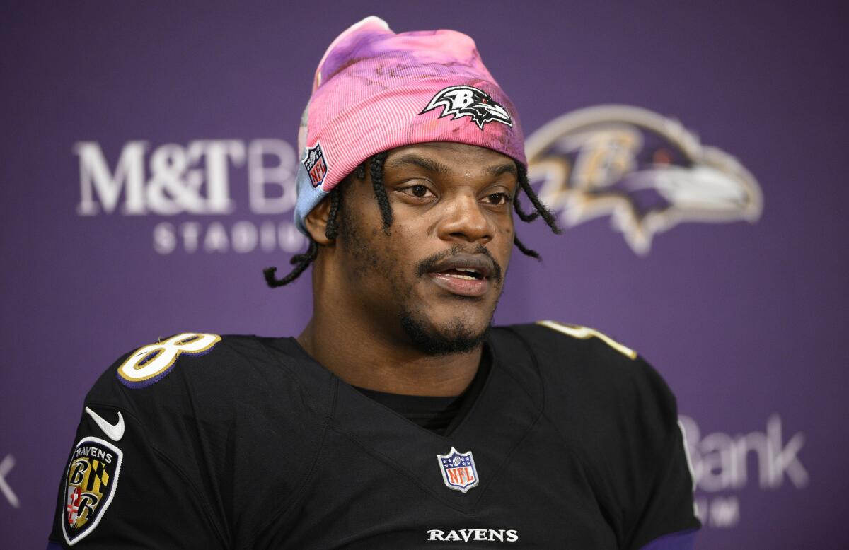 Baltimore Ravens quarterback Lamar Jackson speaks to the media at a press conference.