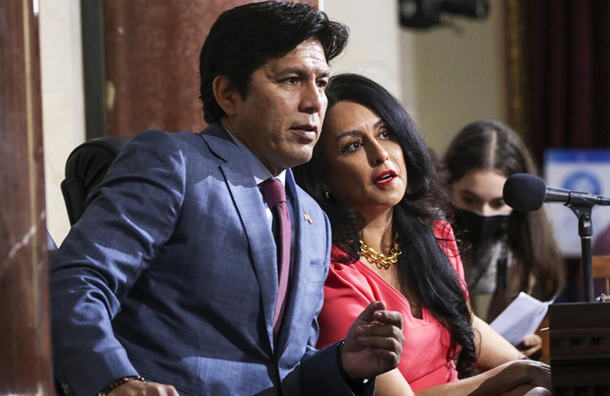 Los Angeles Councilmember Kevin de León and then-Council President Nury Martinez confer at a meeting.