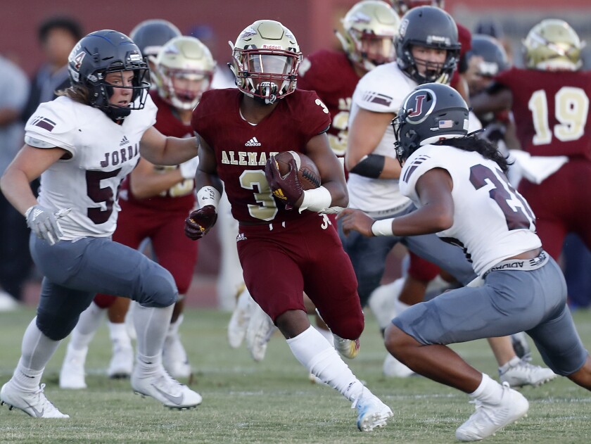 Alemany running back Floyd Chalk carries the ball during the Warriors' victory over Sandy (Utah) Jordan on Friday.