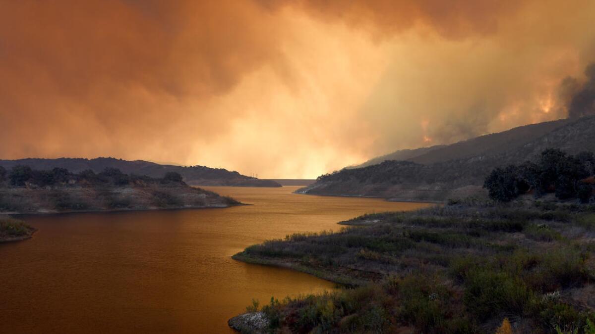 Smoke from the Thomas fire hovers over Lake Casitas near Ojai.