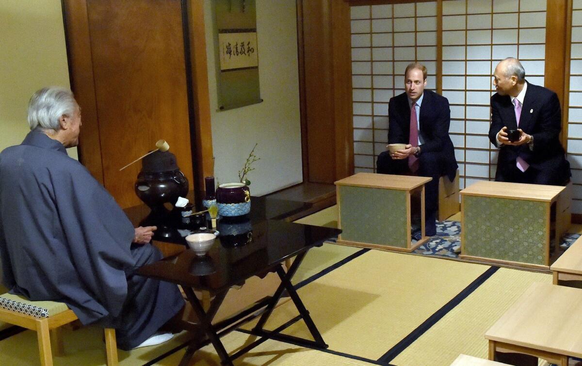 Britain's Prince William and Tokyo Gov. Yoichi Masuzoe are served tea by Sen Genshitsu, left, a former grand master of the Urasenke during a tea ceremony at a traditional teahouse at Hamarikyu Garden in Tokyo on Feb. 26, 2015.