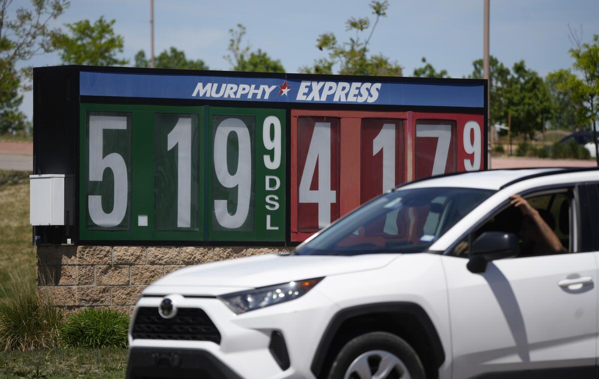 Gasoline prices are displayed outside a convenience store