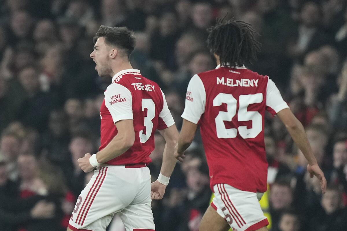 Arsenal's Kieran Tierney, left, celebrates scoring his side's first goal during the Europa League Group A soccer match between Arsenal and FC Zurich at the Emirates stadium in London, Thursday, Nov. 3, 2022. (AP Photo/Frank Augstein)
