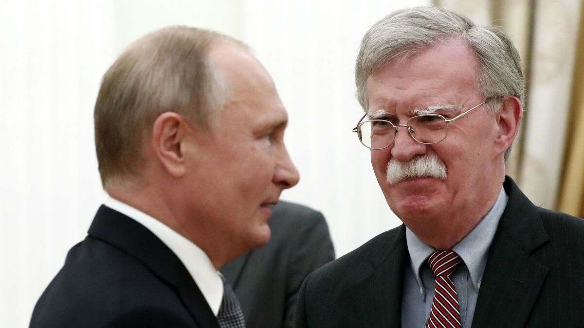 Russian President Vladimir Putin meets with U.S. national security advisor John Bolton in Moscow on Oct. 23.