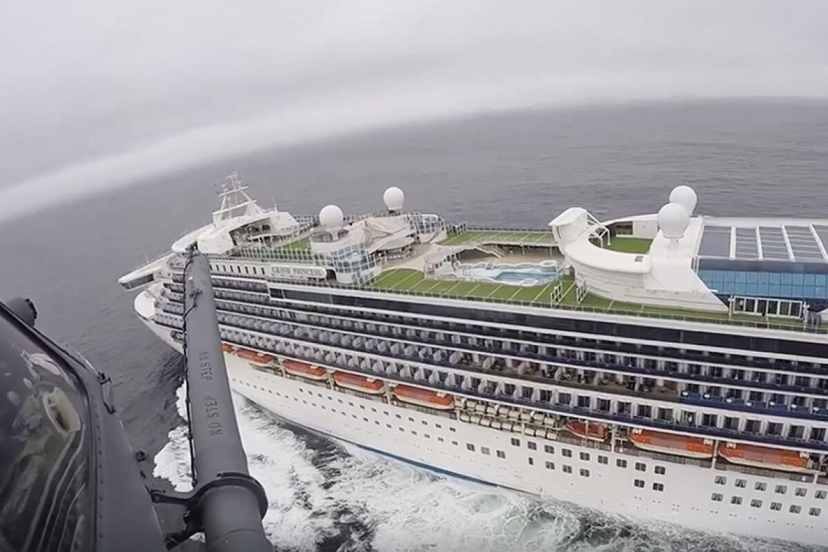 A California National Guard helicopter hovers over the Grand Princess cruise ship off the coast of California on Thursday.