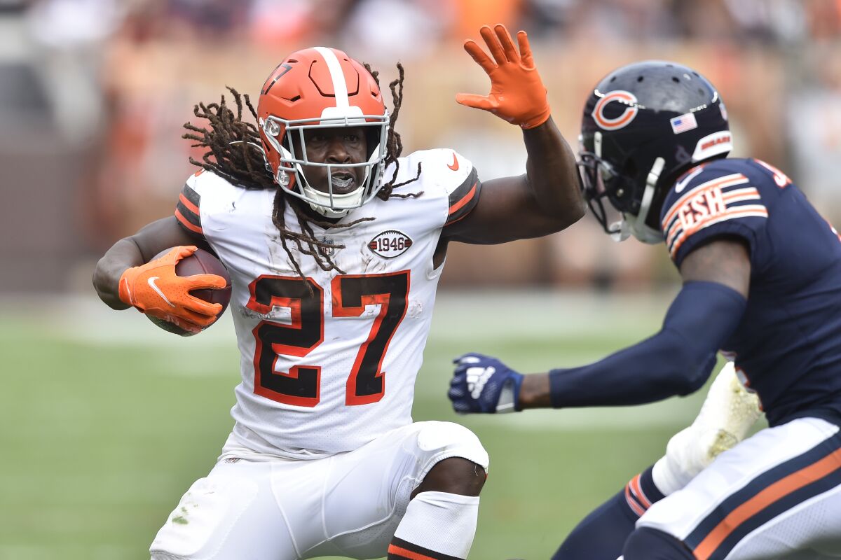 Cleveland Browns running back Kareem Hunt (27) rushes against Chicago Bears free safety Eddie Jackson (4) during the second half of an NFL football game, Sunday, Sept. 26, 2021, in Cleveland. (AP Photo/David Richard)