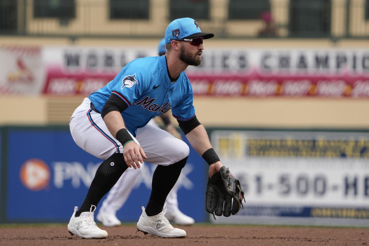 Miami Marlins third baseman Jon Berti takes up his position during the first inning of a spring training baseball game against the New York Mets Saturday, March 2, 2024, in Jupiter, Fla. (AP Photo/Jeff Roberson)