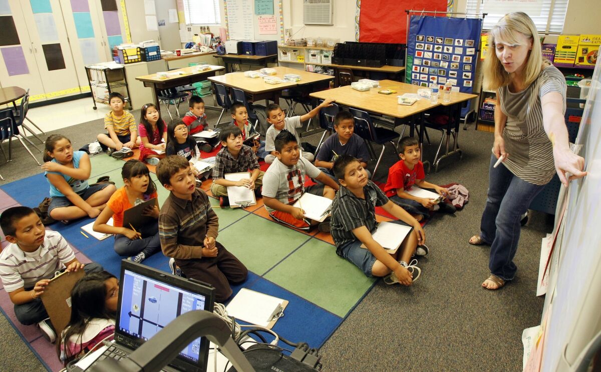 Third-graders study math with teacher Kelly Nytes at Central Elementary School in undated photo.