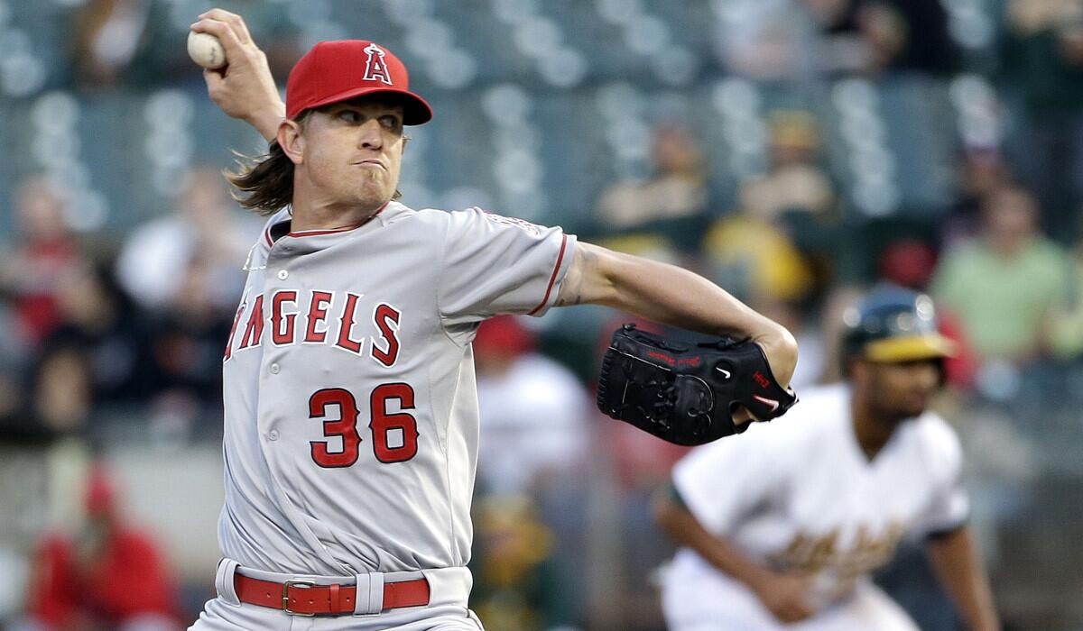 Angels starting pitcher Jered Weaver pitches during a 6-2 loss to the Oakland Athletics on Tuesday.