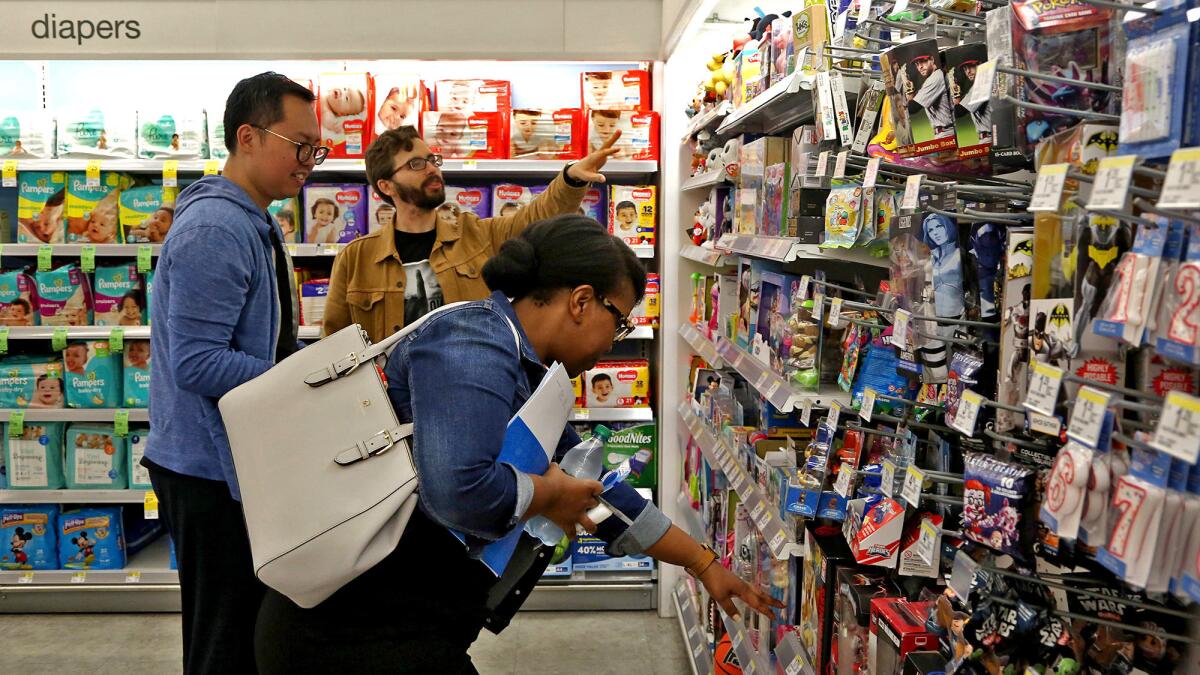 Chay, left, Koren, center, and Mulokwa at a Walgreens in Hollywood.