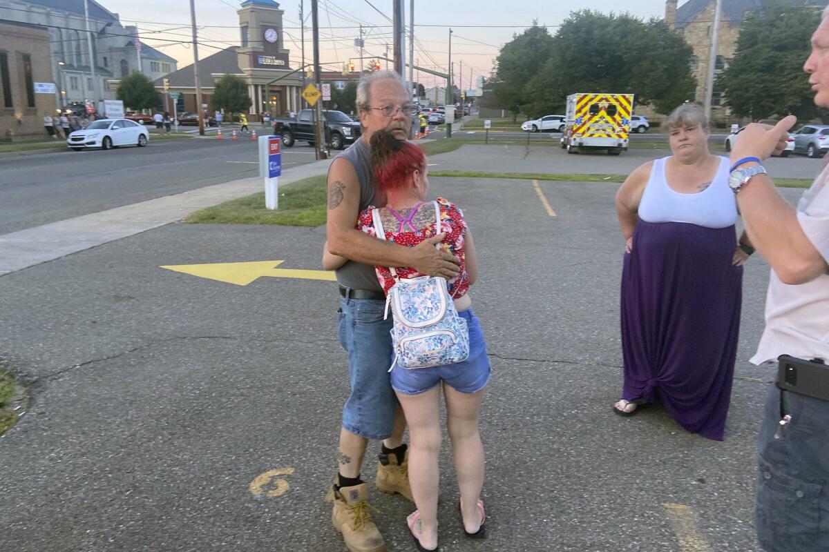 Man and woman embracing to comfort each other