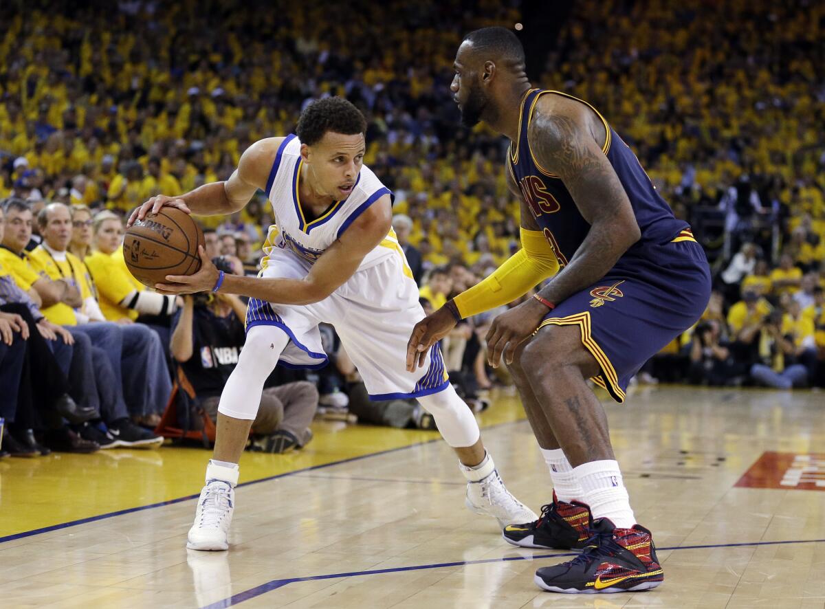 FILE - In this June 14, 2015, file photo, Golden State Warriors guard Stephen Curry, left, is guarded by Cleveland Cavaliers forward LeBron James during the second half of Game 5 of basketball's NBA Finals in Oakland, Calif. While there have been 14 rematches in NBA Finals history, this year's meeting between LeBron James' Cleveland Cavaliers and Stephen Curry's Golden State Warriors will be the first trilogy in league history. (AP Photo/Ben Margot, File)