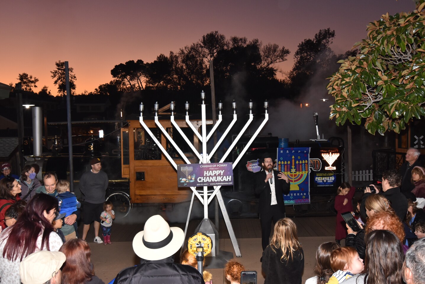 Rabbi Mendel welcomes everyone to the first Chabad of Poway Chanukah celebration at Old Poway Park.