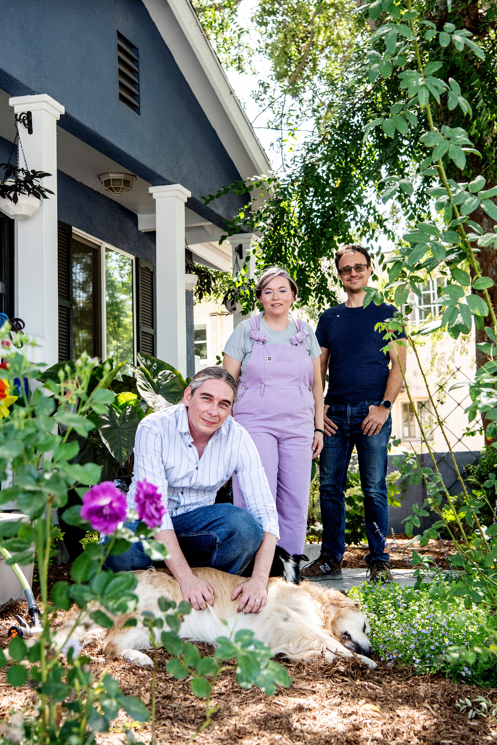 A family and their dog in their garden 