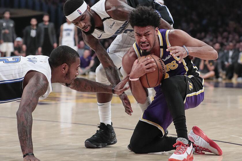LOS ANGELES, CA, WEDNESDAY, JANUARY 15, 2020 - Los Angeles Lakers guard Quinn Cook (2) controls a loose ball from Orlando Magic forward BJ Johnson (13) and forward Gary Clark (12) during second half action at Staples Center. (Robert Gauthier/Los Angeles Times)
