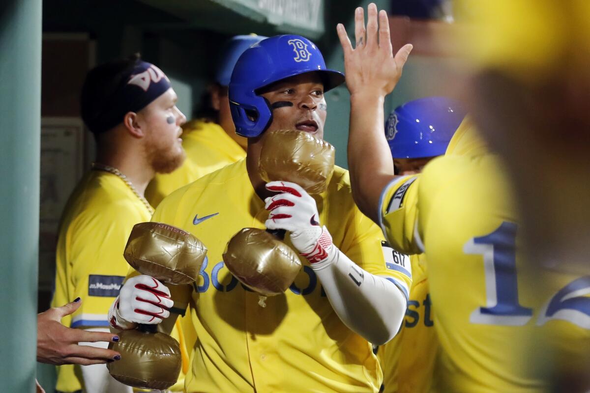 Rafael Devers stares down Cal Quantrill on his way back to the