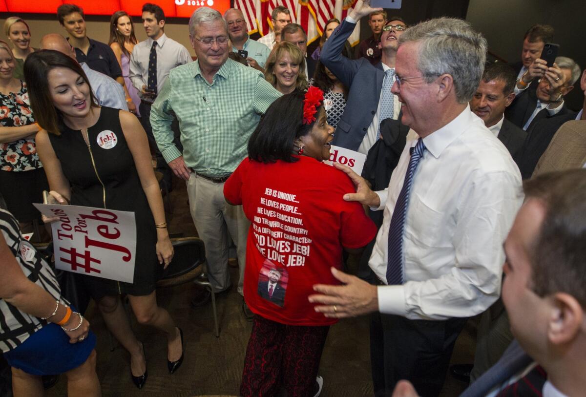 Republican presidential candidate and former Florida Gov. Jeb Bush laughs at a supporter's shirt after delivering a speech on government reform in Tallahassee, Fla., on July 20.