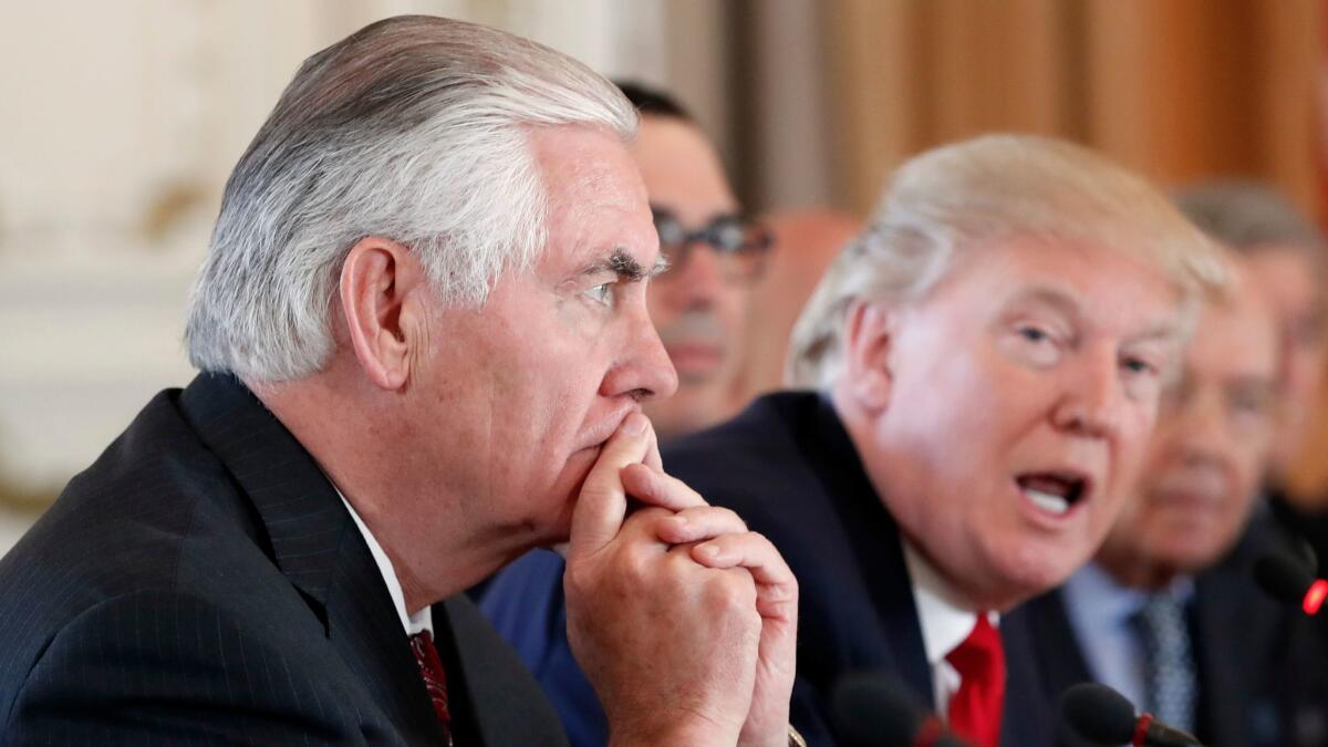 Secretary of State Rex Tillerson listens as President Donald Trump speaks at Mar-a-Lago in Palm Beach, Fla., on April 7.