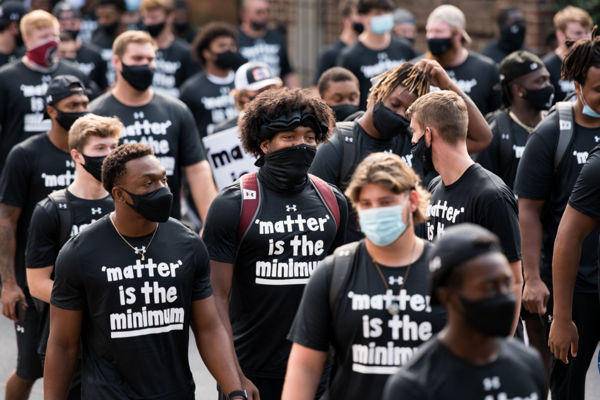South Carolina football players participate in a demonstration against racial inequality and police brutality on Aug. 31.