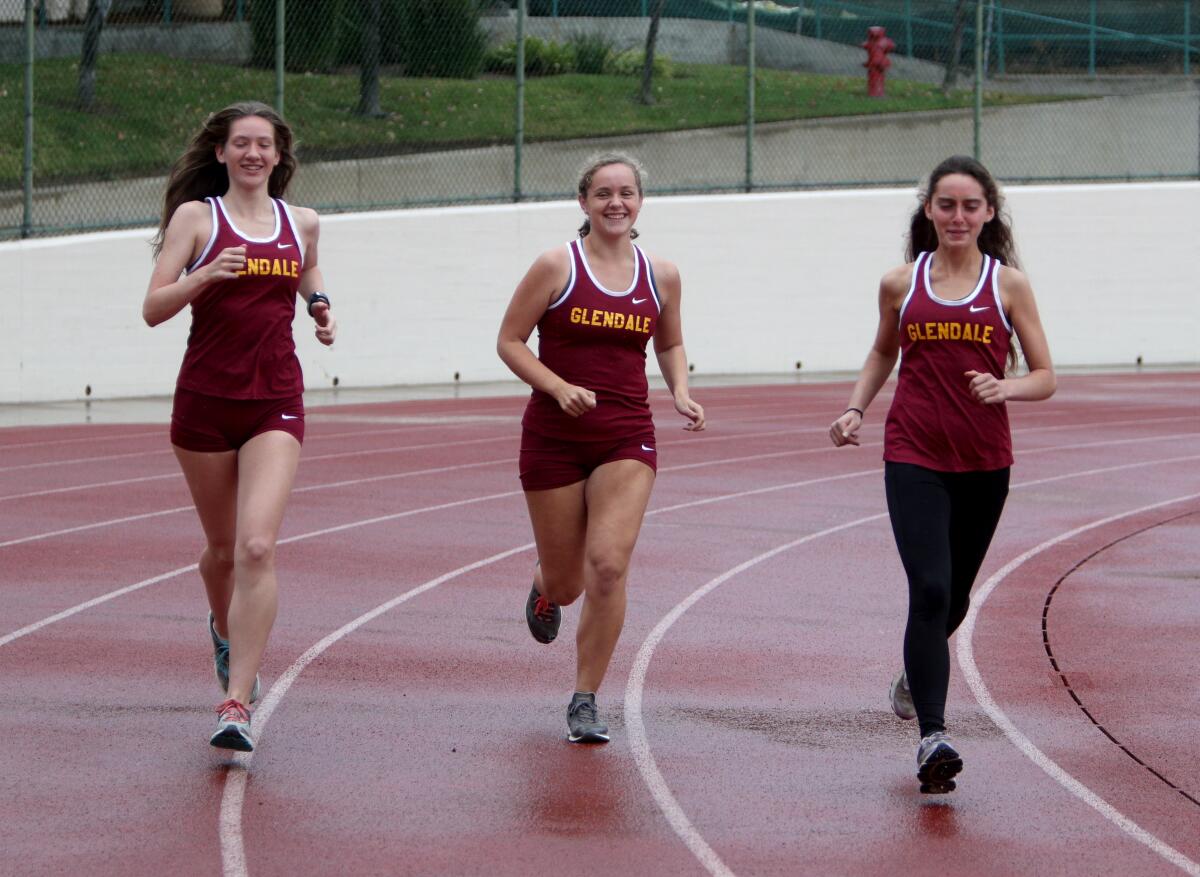 Glendale Community College cross country team members who will be competing for the state championship are, from left to right, sophomore Phoebe Forsyth, 20, freshman Lydia Forsyth, 18, and freshman Jamie Levin, 19, all from Burbank High School, at the college field in Glendale on Wednesday, Nov. 20, 2019.