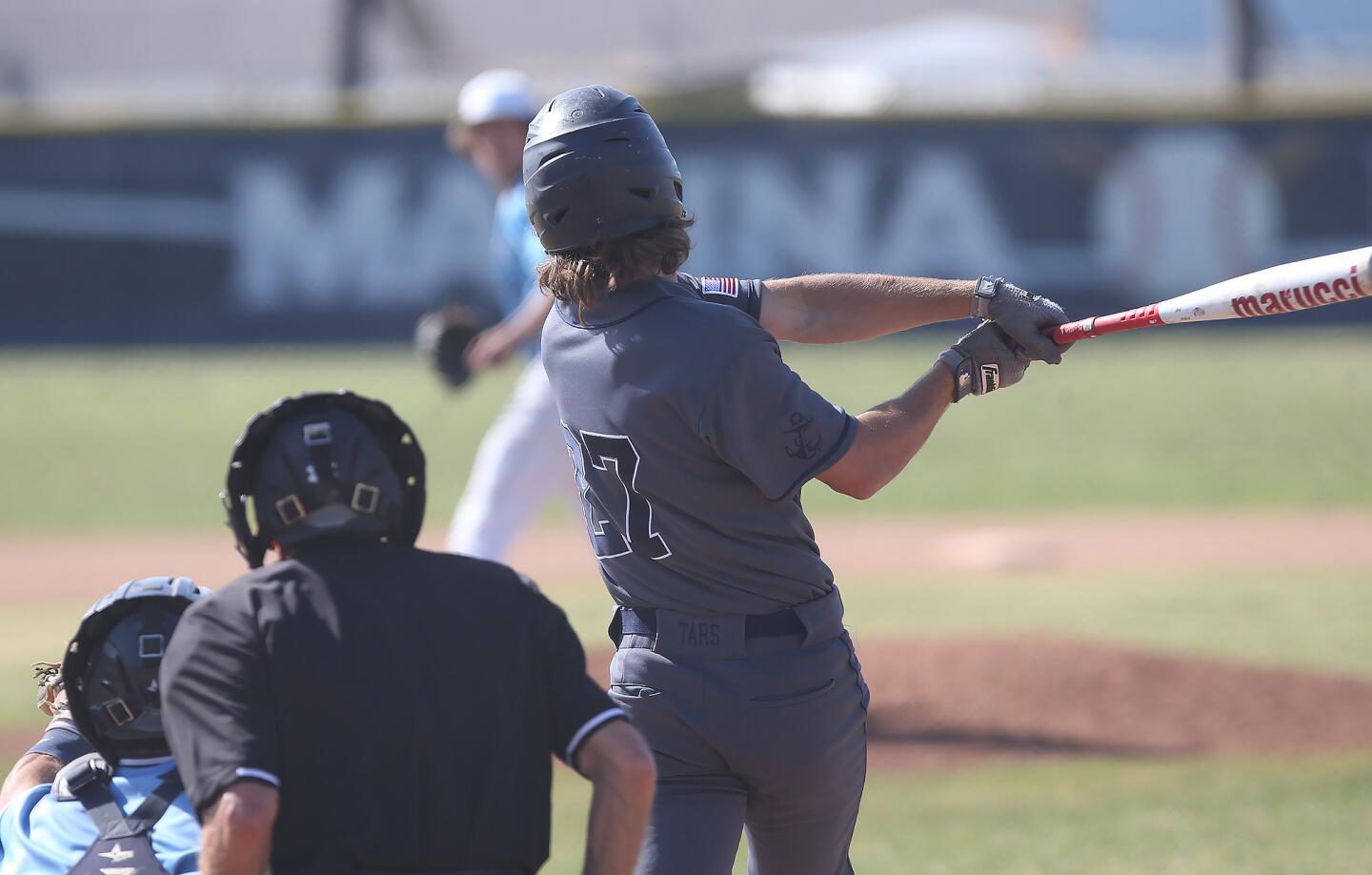 Newport Harbor's Jack Bibb hits a two-run home run over the right-field fence in a Wave League game at Marina on Tuesday.