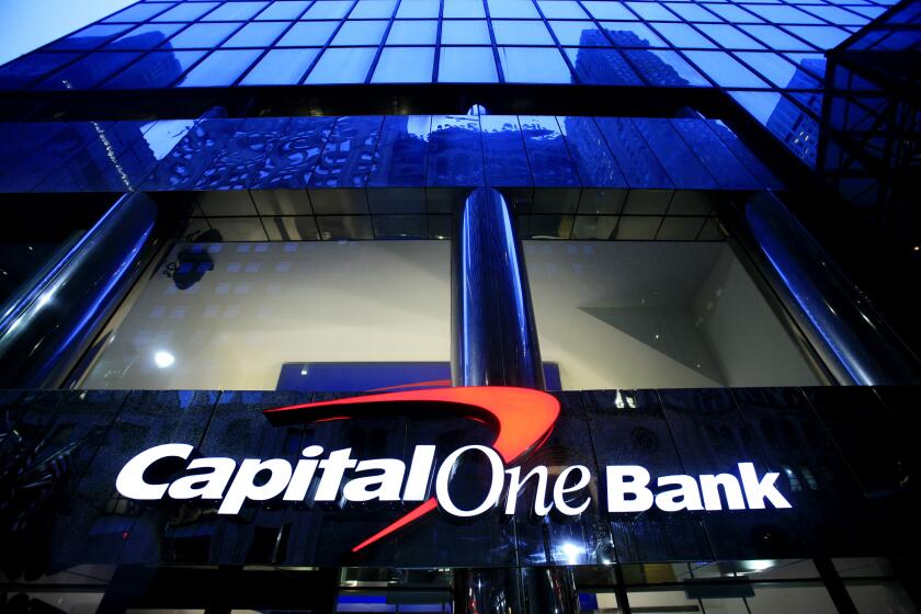 FILE - A branch office of Capital One Bank is pictured on May 7, 2009, in New York. Capital One Financial is buying Discover Financial Services for $35 billion, in a deal that would bring together two of the nation's biggest lenders and credit card issuers, according to a news release issued by the companies Monday, Feb. 19, 2024. (AP Photo/Mark Lennihan, File)