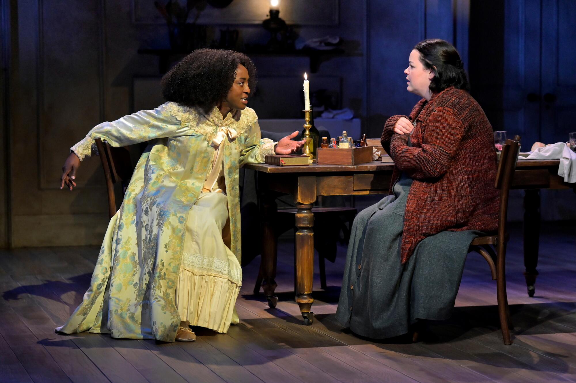 Two women seated astatine a table, 1 leaning guardant urgently
