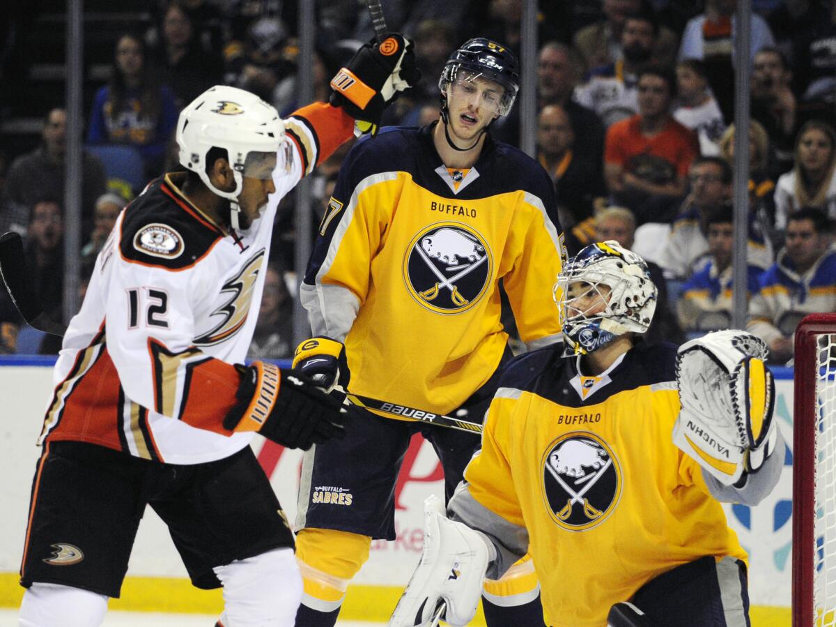 Ducks right winger Devante Smith-Pelly, left, celebrates a goal by William Karlsson as Sabres defenseman Tyler Myers and goaltender Michal Neuvirth react last week in Buffalo.