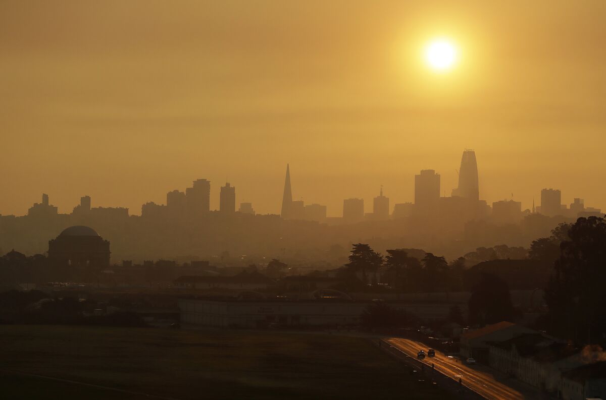 Smoke and haze from wildfires hovers over the San Francisco skyline Thursday.
