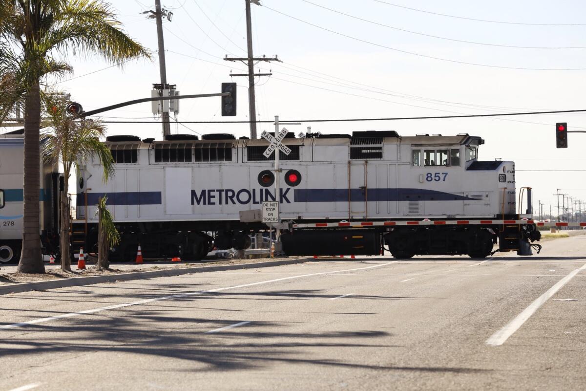 <p>A <runtime:topic id="ORGOVV0000365">Metrolink</runtime:topic> train moves through Oxnard on Feb. 25.</p>