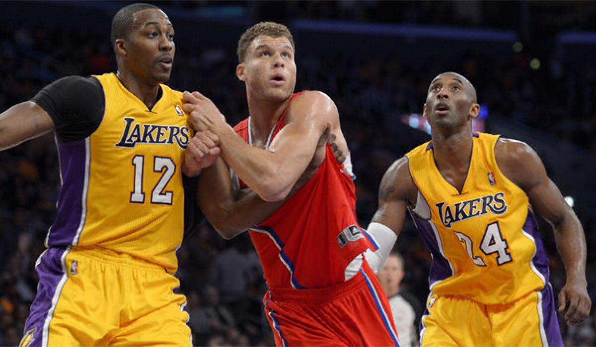 Lakers center Dwight Howard, left, and guard Kobe Bryant -- shown flanking Clippers forward Blake Griffin -- developed an on-court chemistry as the season progressed, and their personal relationship has grown recently, too.