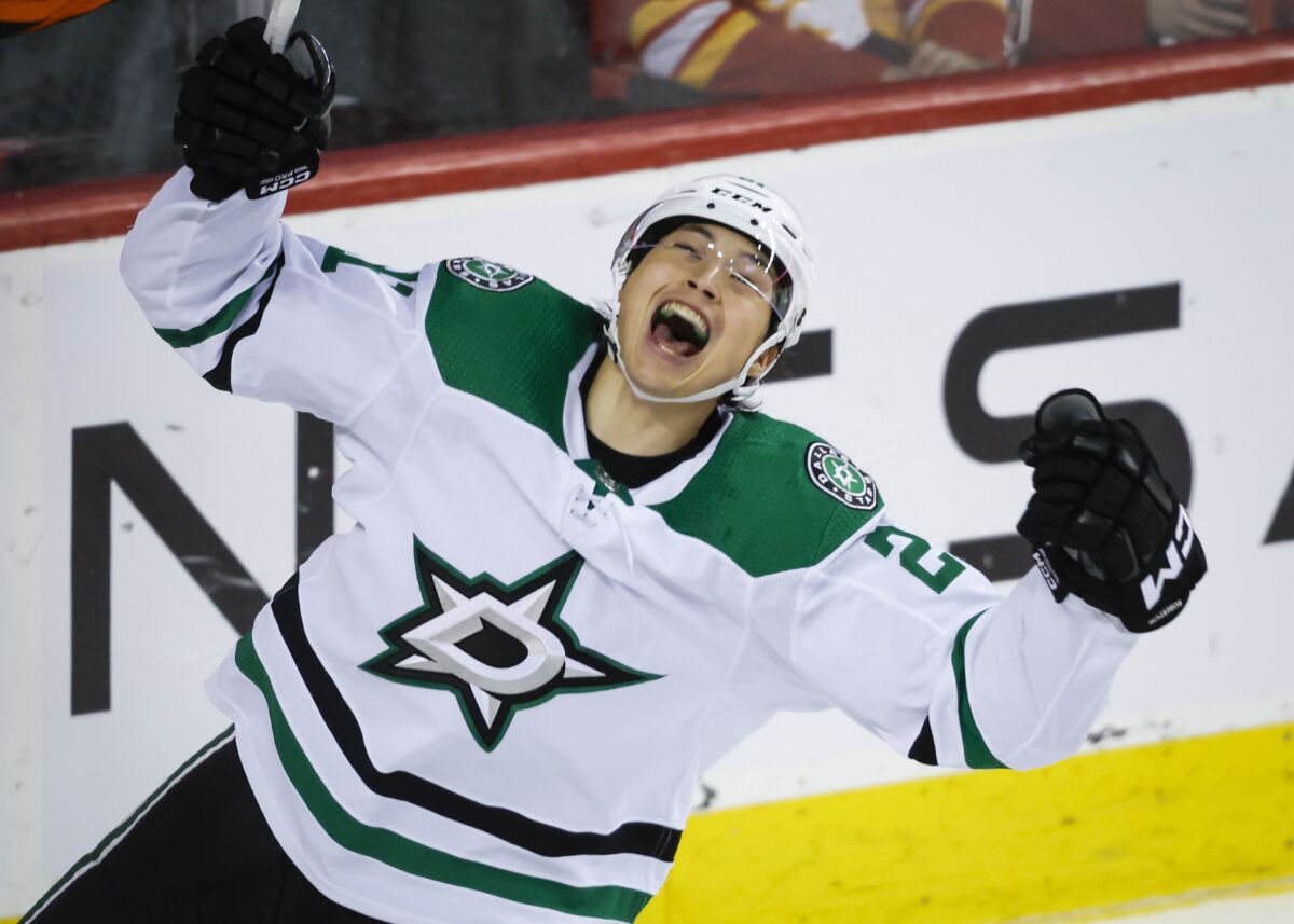 Dallas Stars forward Jason Robertson celebrates his overtime goal against the Calgary Flames during an NHL hockey game Saturday, March 18. 2023, in Calgary, Alberta. (Jeff McIntosh/The Canadian Press via AP)
